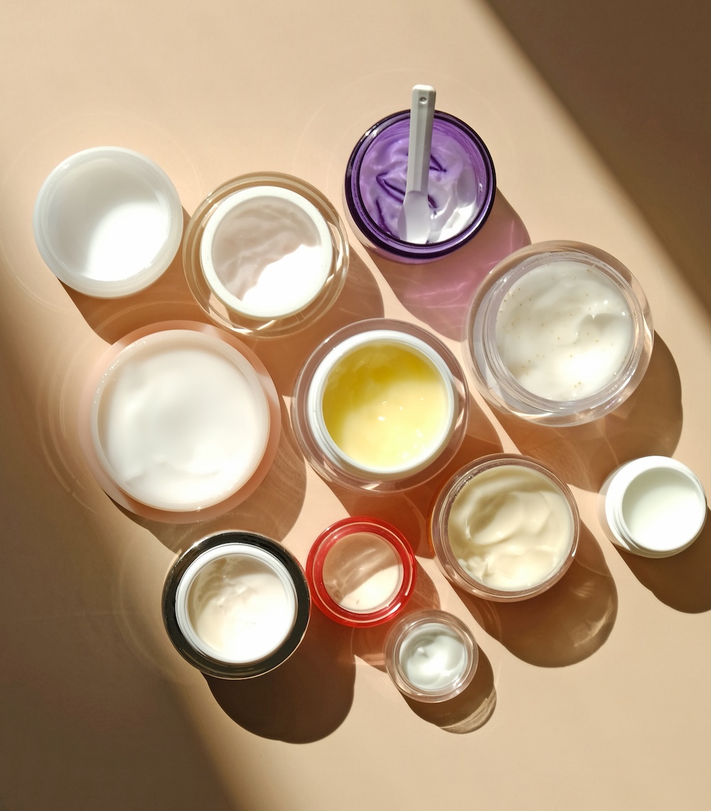 Skincare routine products arranged on a surface representing retinoid formulations